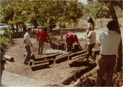 CIMC Youth workers building a retaining wall between the old Tribal Hall and today's Fire Dept. & Education Center in 1978.